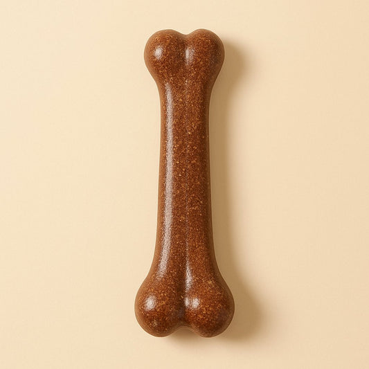 Natural dog chew toy bone on a warm cream background