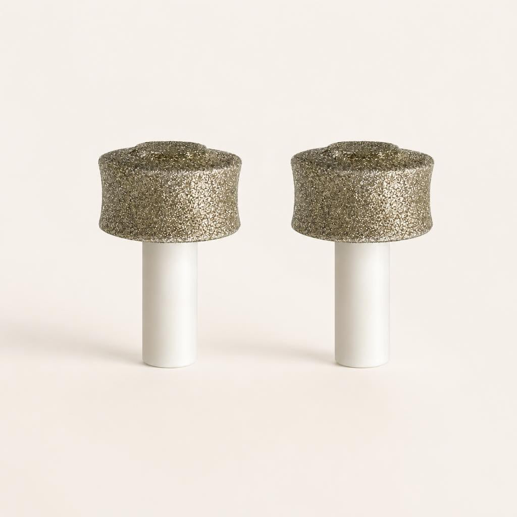 Two PawGrind replacement grinding heads