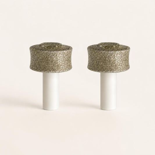 Two PawGrind replacement grinding heads